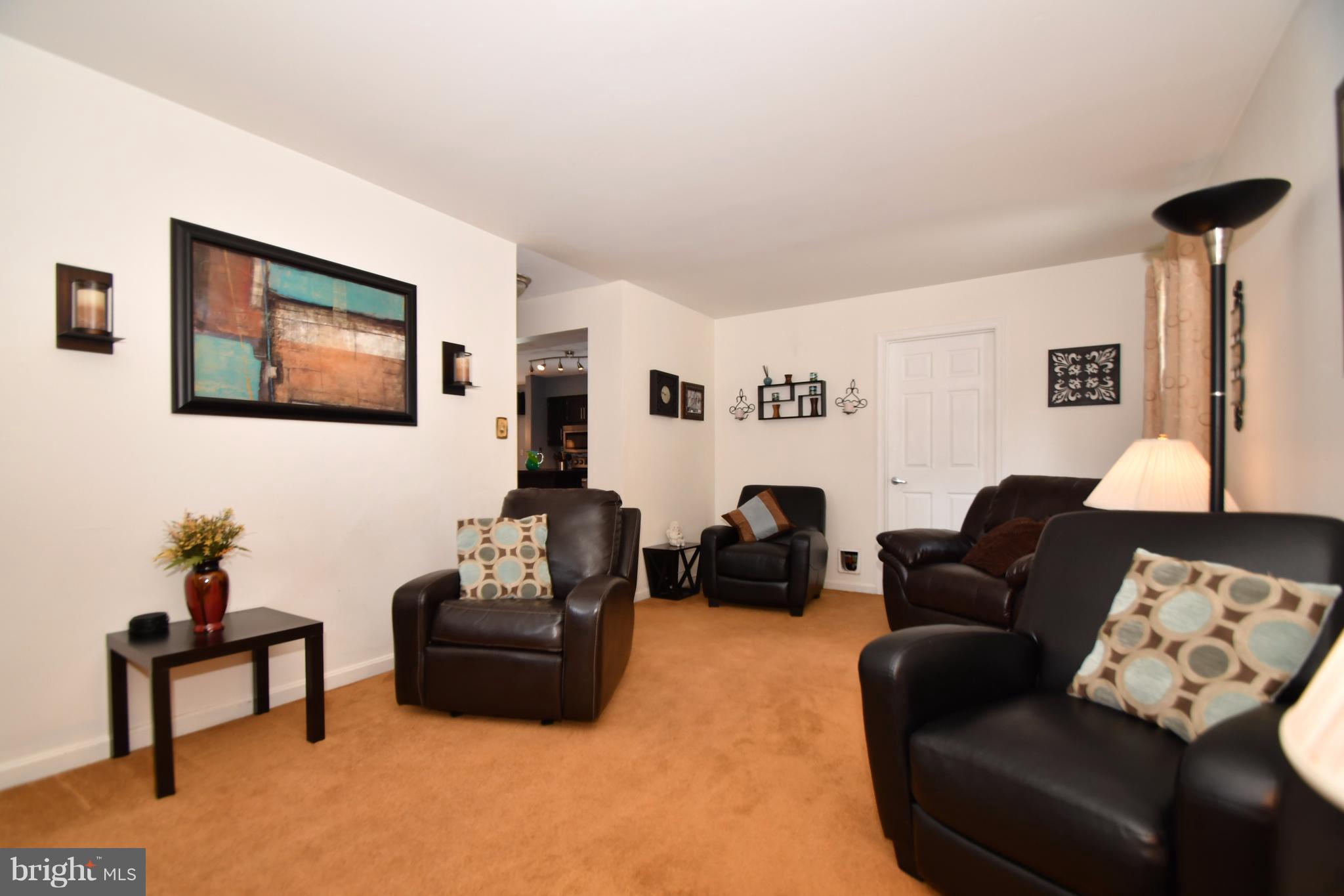 8126 Old Philadelphia Road Baltimore, MD 21237 - Photo 10 of 30 a living room with furniture and a lamp