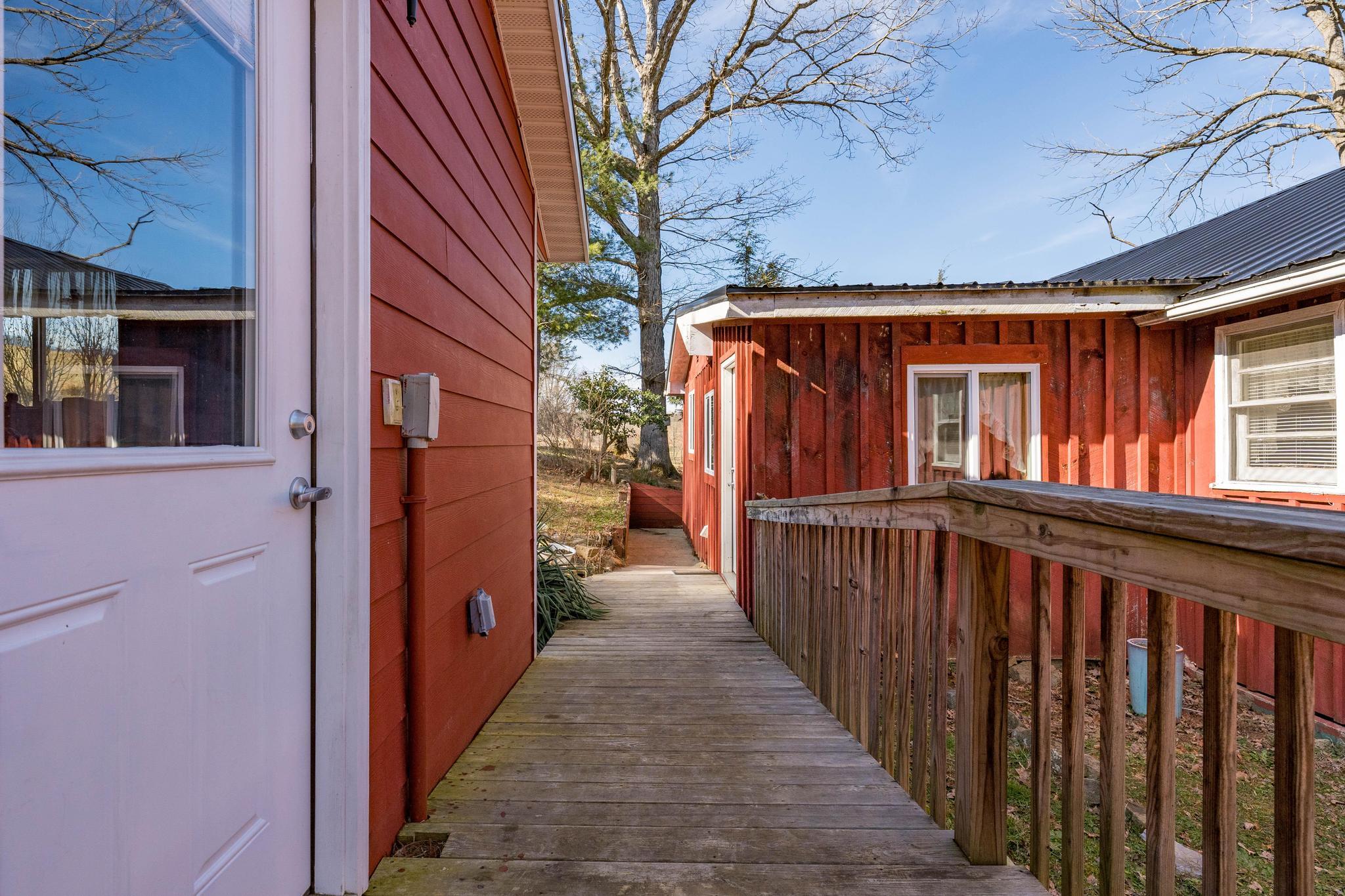 155 Tweed Springs Road Greeneville, TN 37743 - Photo 37 of 48 Walk between Main House & In-law Suite