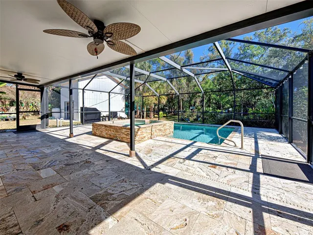 an aerial view of residential house with outdoor space and parking