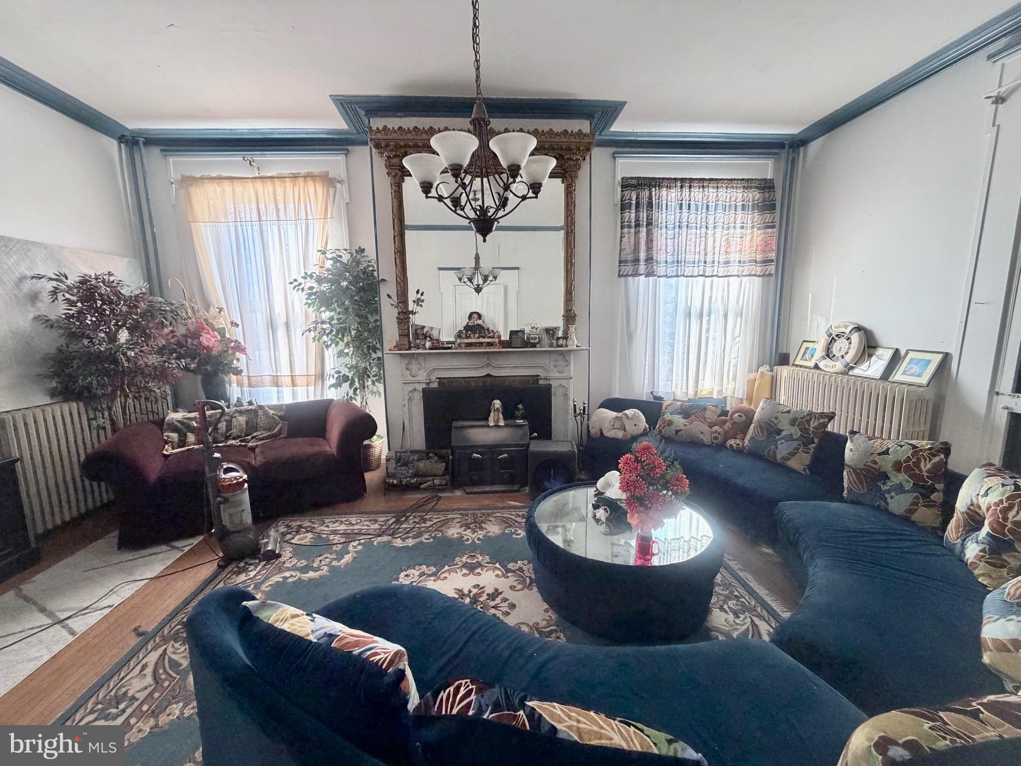 95 Mill Street Mount Holly, NJ 08060 - Photo 5 of 15 a living room with furniture fireplace and a large window