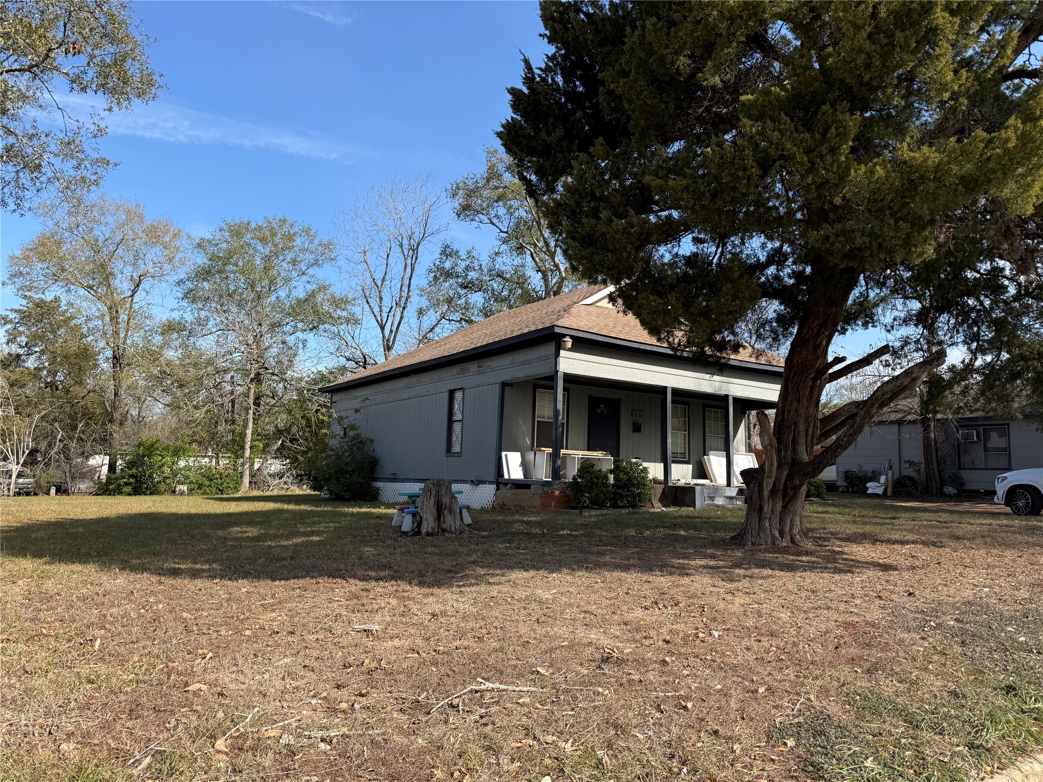 412 Waco Street Conroe, TX 77301 - Photo 2 of 50 a front view of house with yard and trees in the background