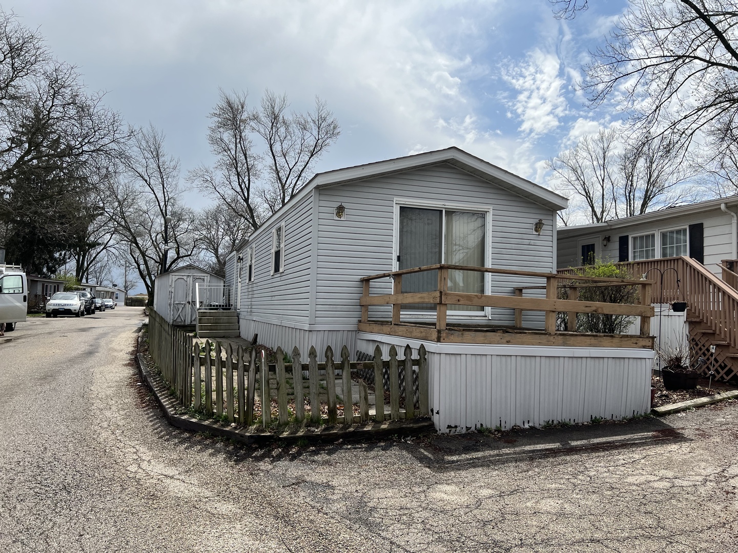240 Whitney Road, Unit 21 Lake Zurich, IL 60047 - Photo 11 of 13 a view of a house with a yard and sitting area
