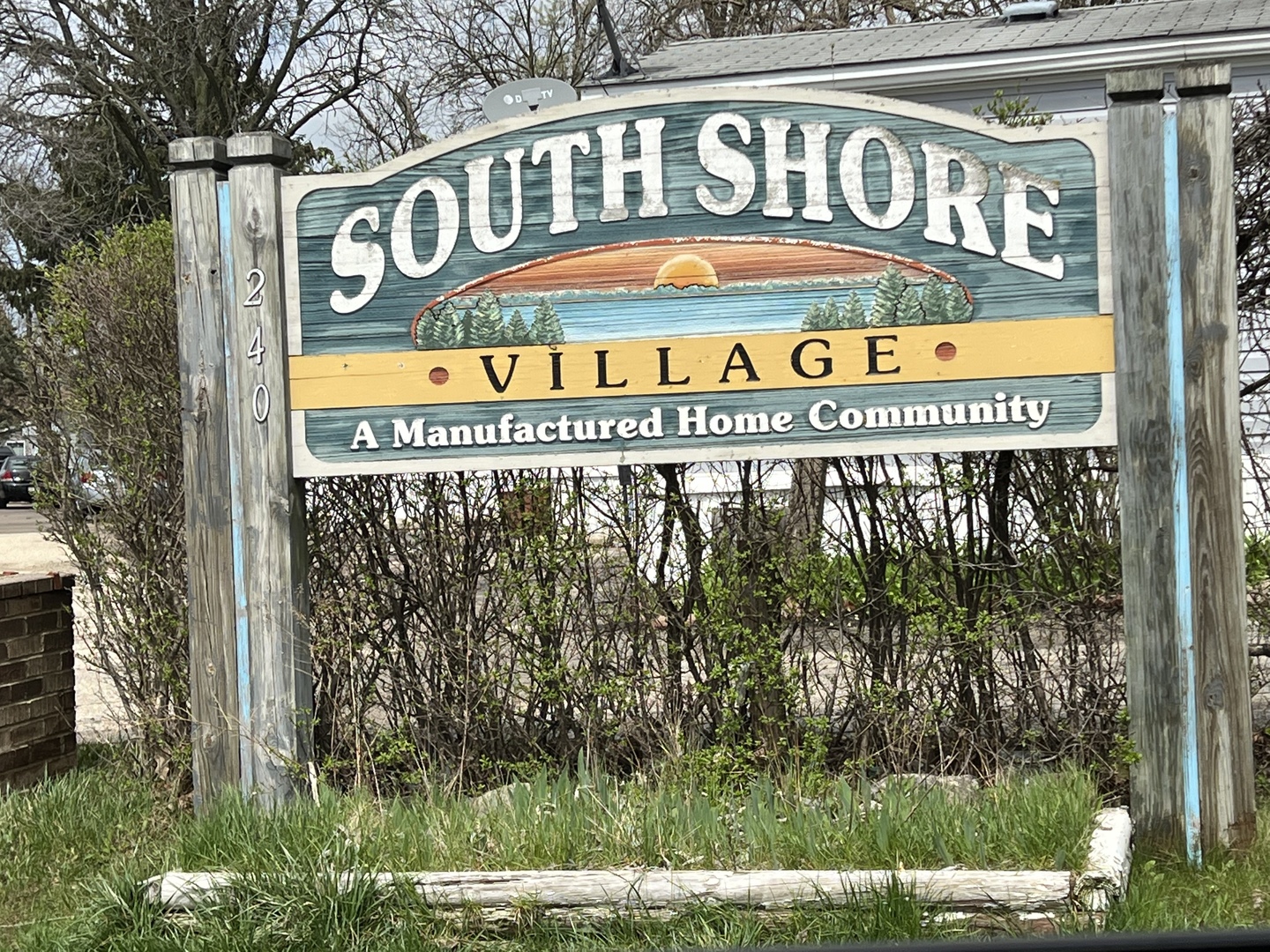 240 Whitney Road, Unit 21 Lake Zurich, IL 60047 - Photo 12 of 13 a sign on the side of a building