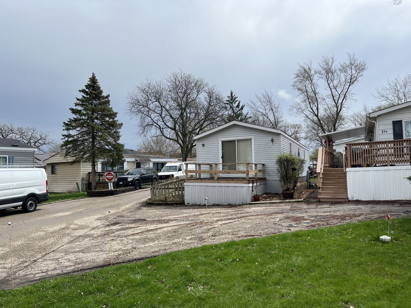 240 Whitney Road, Unit 21 Lake Zurich, IL 60047 - Photo 13 of 13 a view of a house with a yard covered in snow