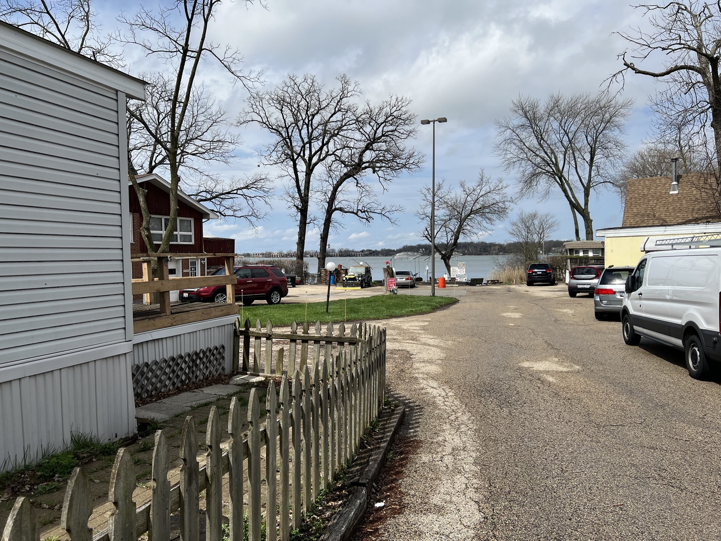 240 Whitney Road, Unit 21 Lake Zurich, IL 60047 - Photo 8 of 13 a view of street with parked cars