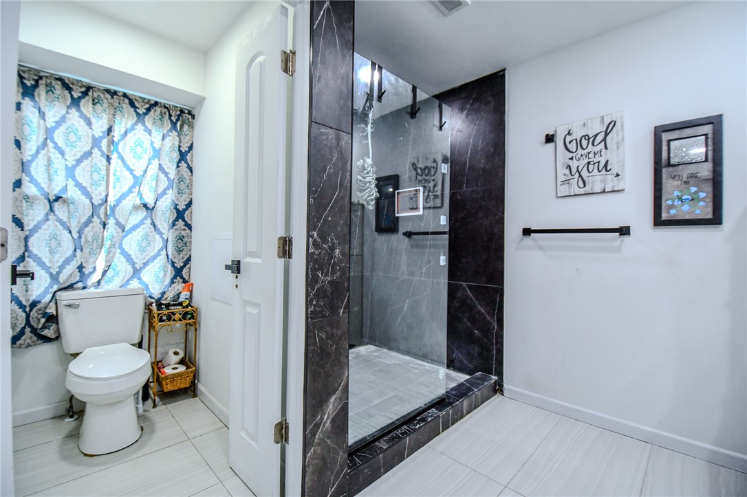 6169 Dayton Farmersville Road Dayton, OH 45417 - Photo 31 of 64 This bathroom features a contemporary shower and elegant tile flooring.