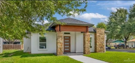 front view of a house with a yard