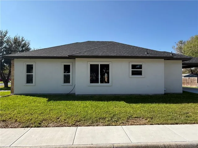 a house view with a garden space