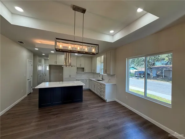 a view of kitchen and sink