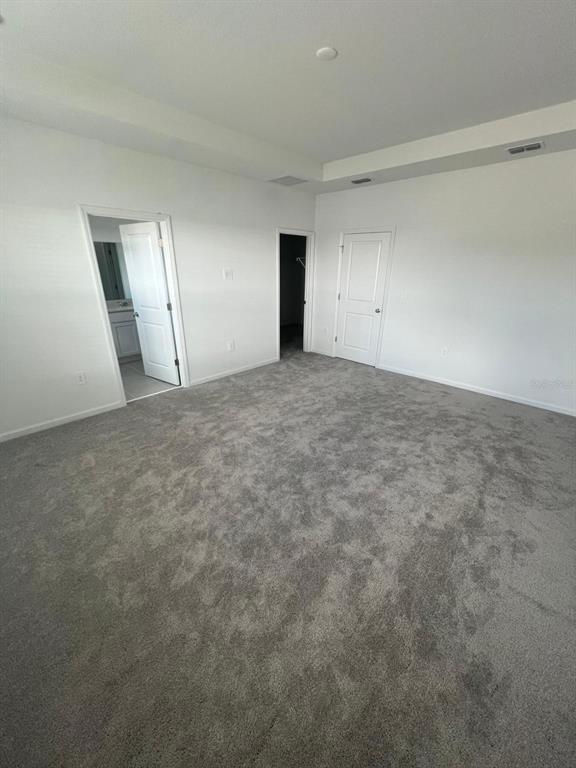 2660 Skyline Loop Kissimmee, FL 34758 - Photo 9 of 19 an empty room with an empty space and a window