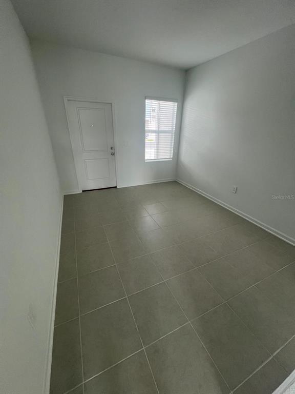 2660 Skyline Loop Kissimmee, FL 34758 - Photo 10 of 19 a view of an empty room with a window