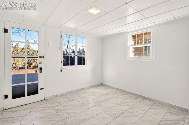 a view of an empty room with a window