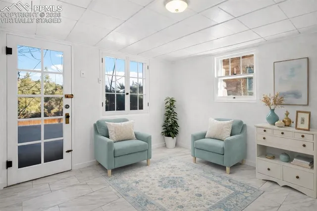 a living room with furniture and windows