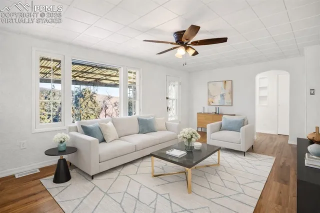 a living room with furniture and a large window