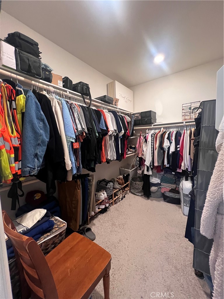 31381 Linden Flower Road Winchester, CA 92596 - Photo 12 of 33 a walk in closet with clothes and shoes