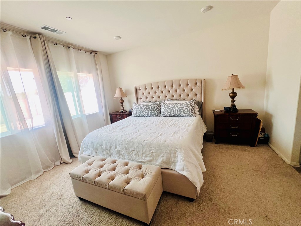 31381 Linden Flower Road Winchester, CA 92596 - Photo 13 of 33 a bedroom with a bed and a couch