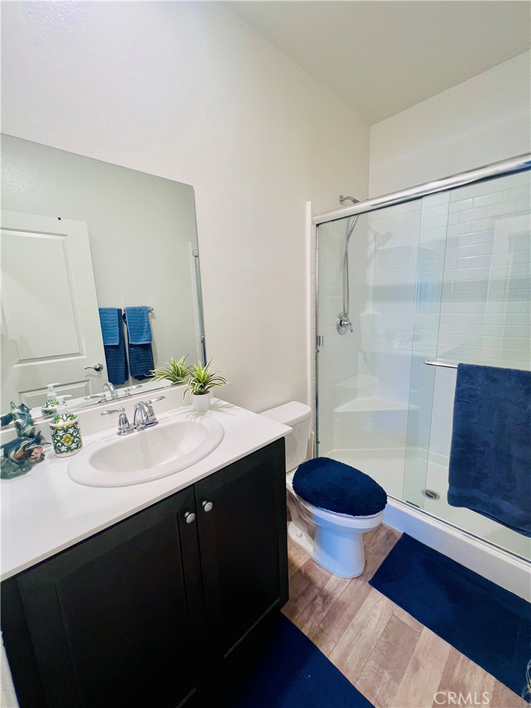31381 Linden Flower Road Winchester, CA 92596 - Photo 16 of 33 a bathroom with a sink and a mirror