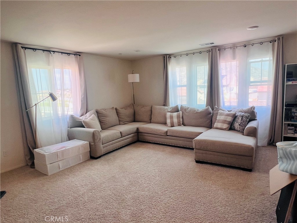 31381 Linden Flower Road Winchester, CA 92596 - Photo 17 of 33 a living room with furniture and a large window