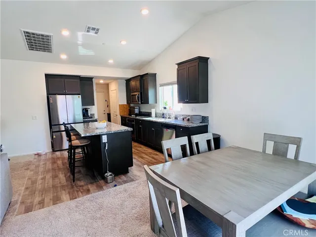 a view of a dining room with furniture