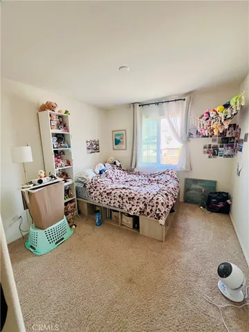 a bedroom with furniture and a bed