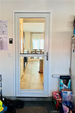 view of living room with baby crib furniture and a window