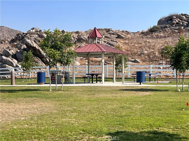a front view of a building with a ocean view