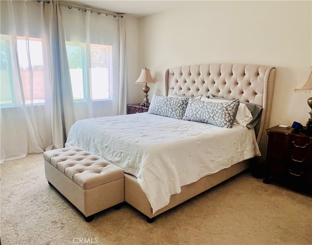 31381 Linden Flower Road Winchester, CA 92596 - Photo 9 of 33 a bedroom with a bed couch and window