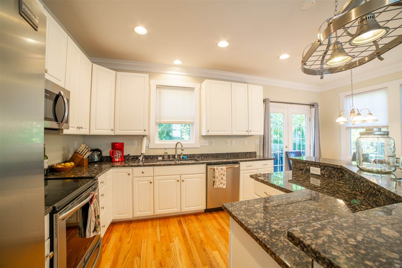 5347 Brookwood Road Crozet, VA 22932 - Photo 16 of 35 a kitchen with stainless steel appliances granite countertop a sink stove and cabinets