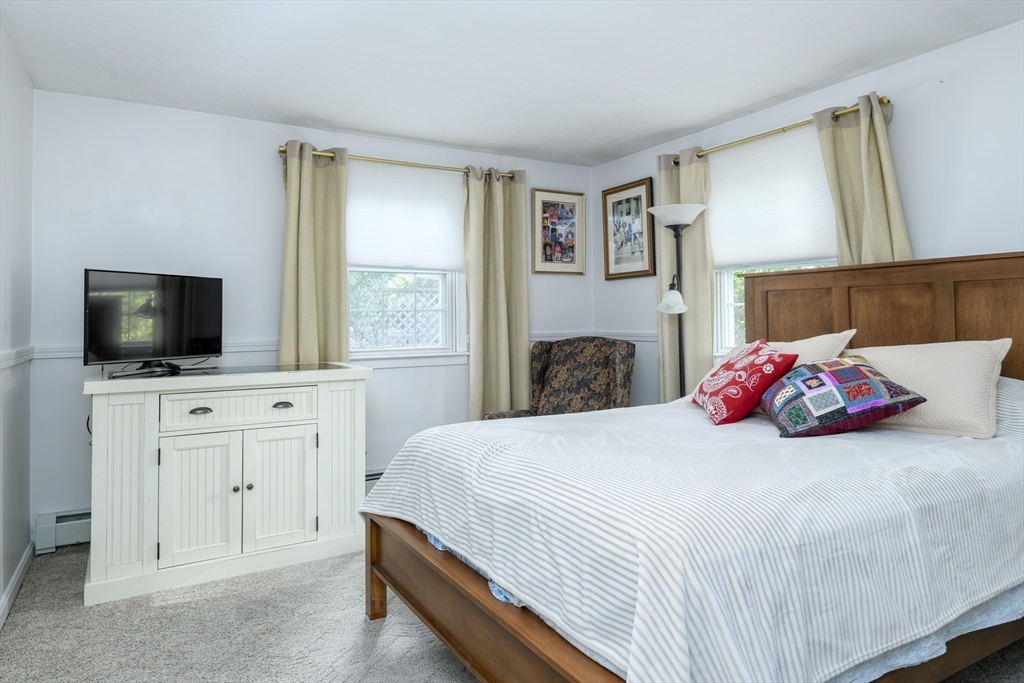 32 Westview Road Worcester, MA 01602 - Photo 8 of 18 a bedroom with a large bed and a flat screen tv