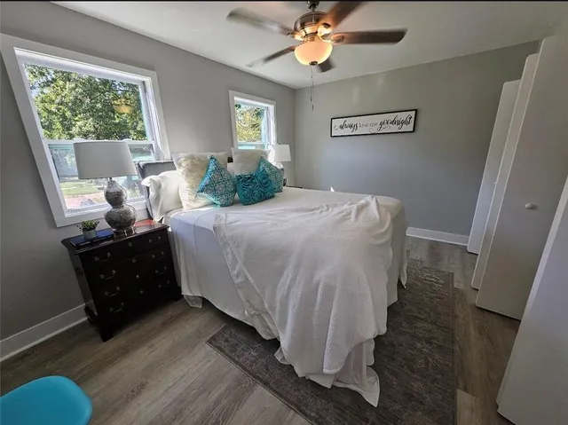 a bedroom with a bed and window