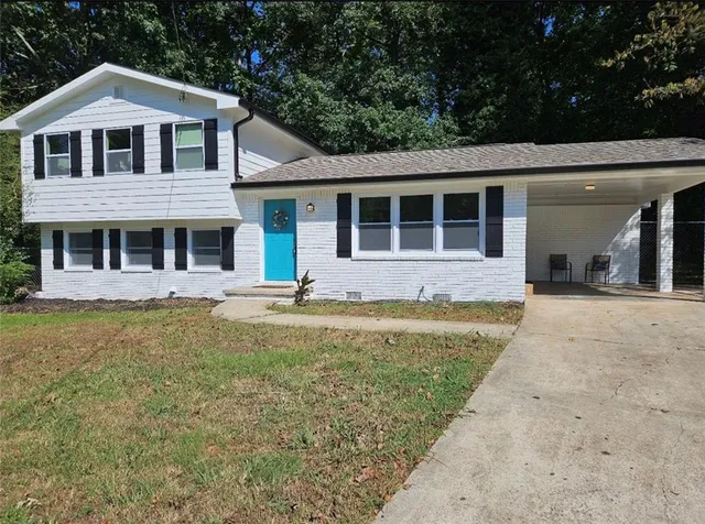 a front view of a house with a yard