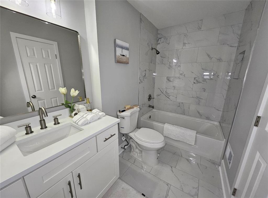 2968 McGlynn Court Decatur, GA 30034 - Photo 20 of 34 a bathroom with a sink a toilet and shower