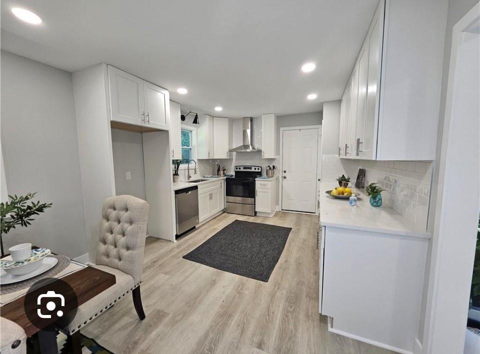 2968 McGlynn Court Decatur, GA 30034 - Photo 2 of 34 a kitchen with stainless steel appliances granite countertop a refrigerator and a stove top oven