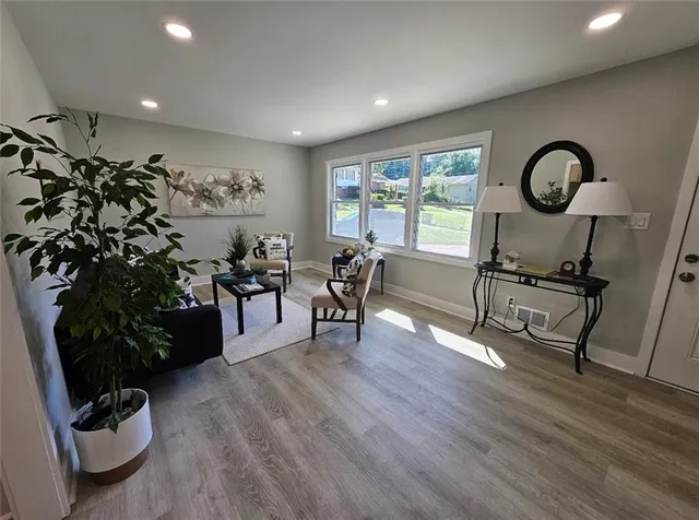 a living room with furniture and a large window
