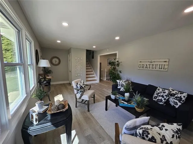 a living room with furniture and a large window