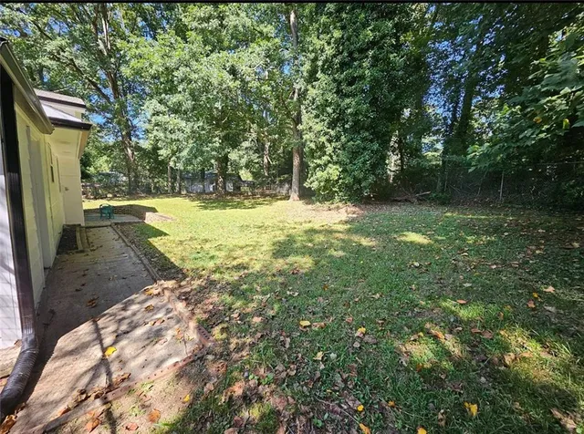 a view of a yard with trees