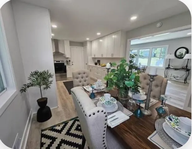 a kitchen with a table and chairs in it