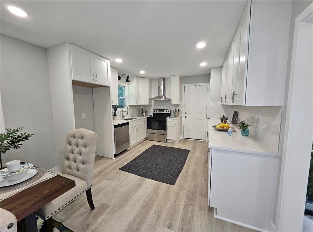 2968 McGlynn Court Decatur, GA 30034 - Photo 8 of 34 a kitchen with stainless steel appliances granite countertop a refrigerator and a stove top oven
