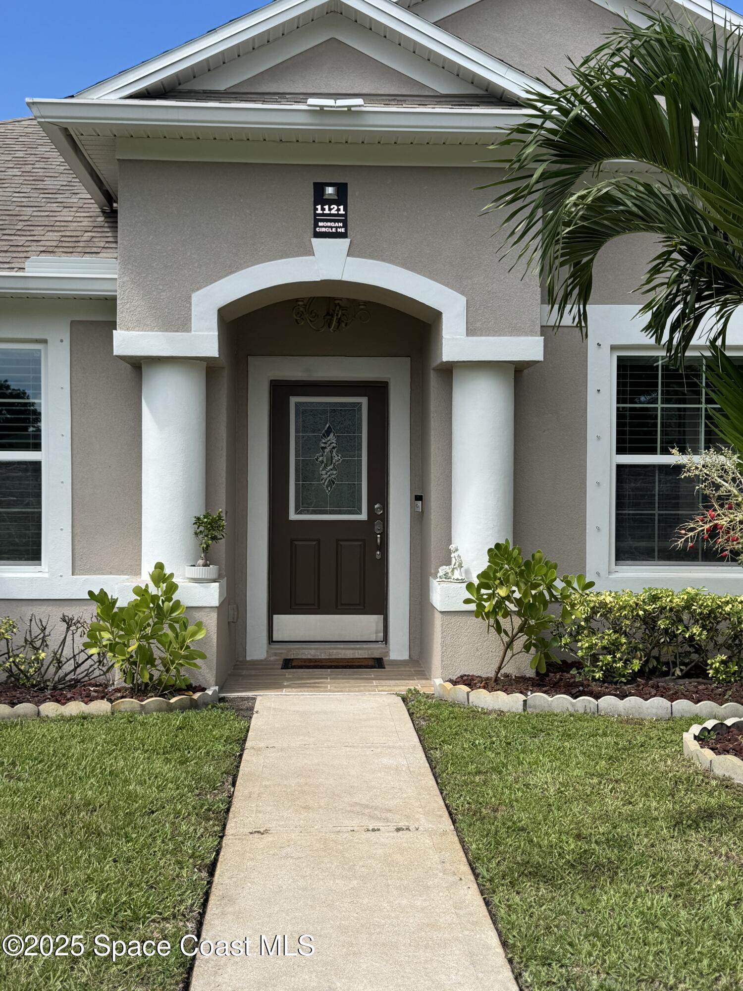 a front view of a house with a yard