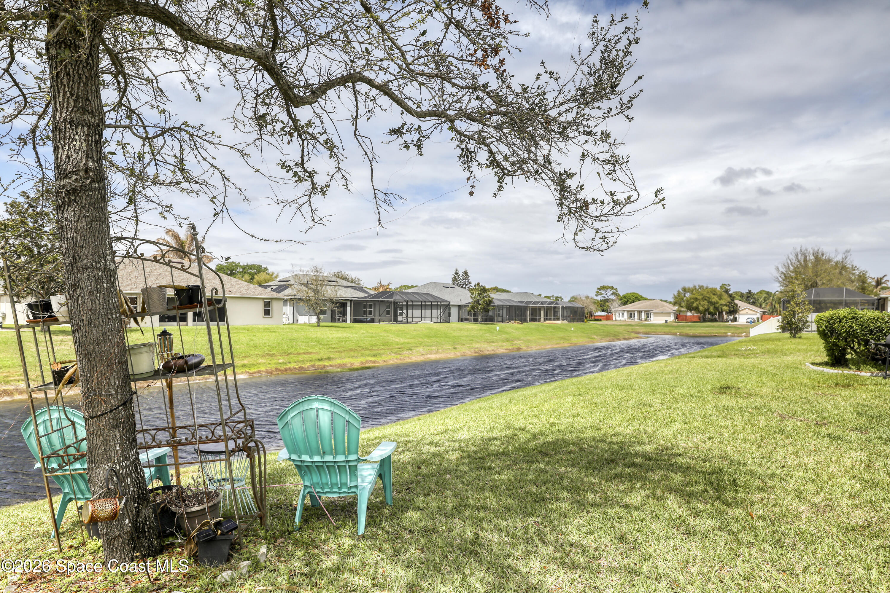 1121 Morgan Circle Northeast Palm Bay, FL 32905 - Photo 102 of 115 a view of swimming pool with outdoor seating and yard