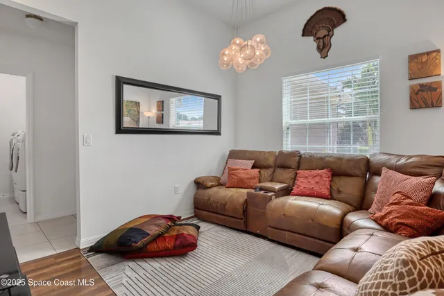 a bedroom with a bed and a mirror on dresser