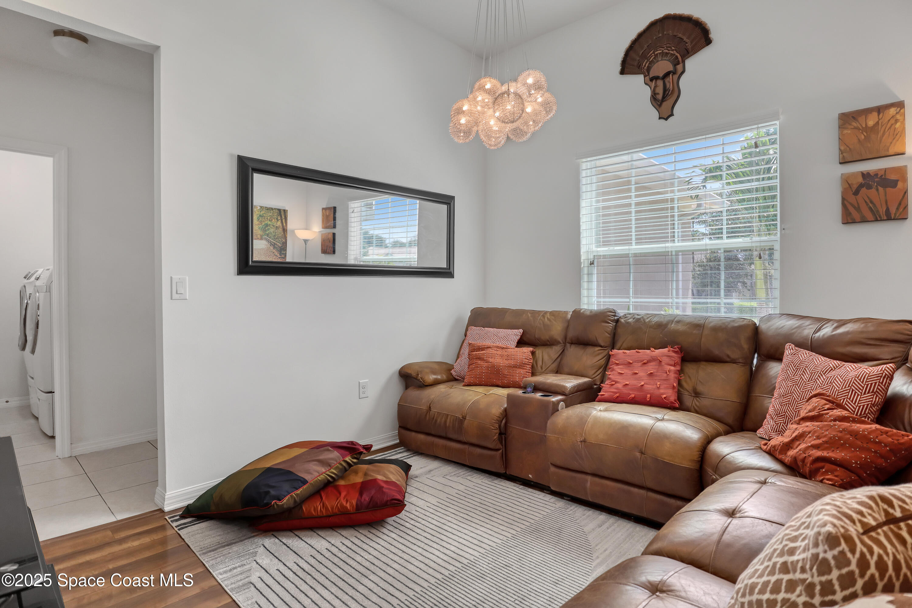 1121 Morgan Circle Northeast Palm Bay, FL 32905 - Photo 13 of 61 a living room with furniture and a window