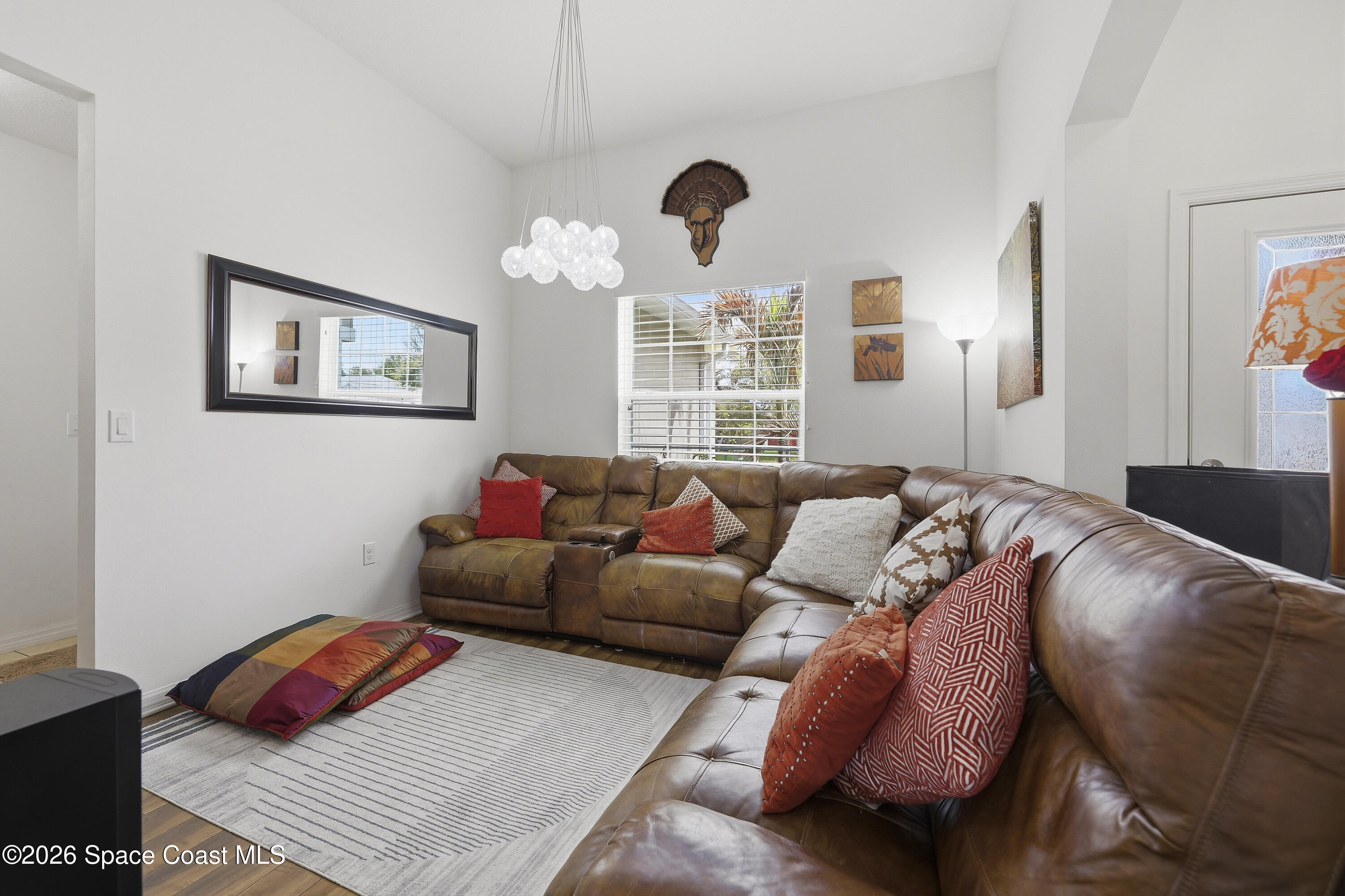 1121 Morgan Circle Northeast Palm Bay, FL 32905 - Photo 17 of 115 a living room with furniture and a window