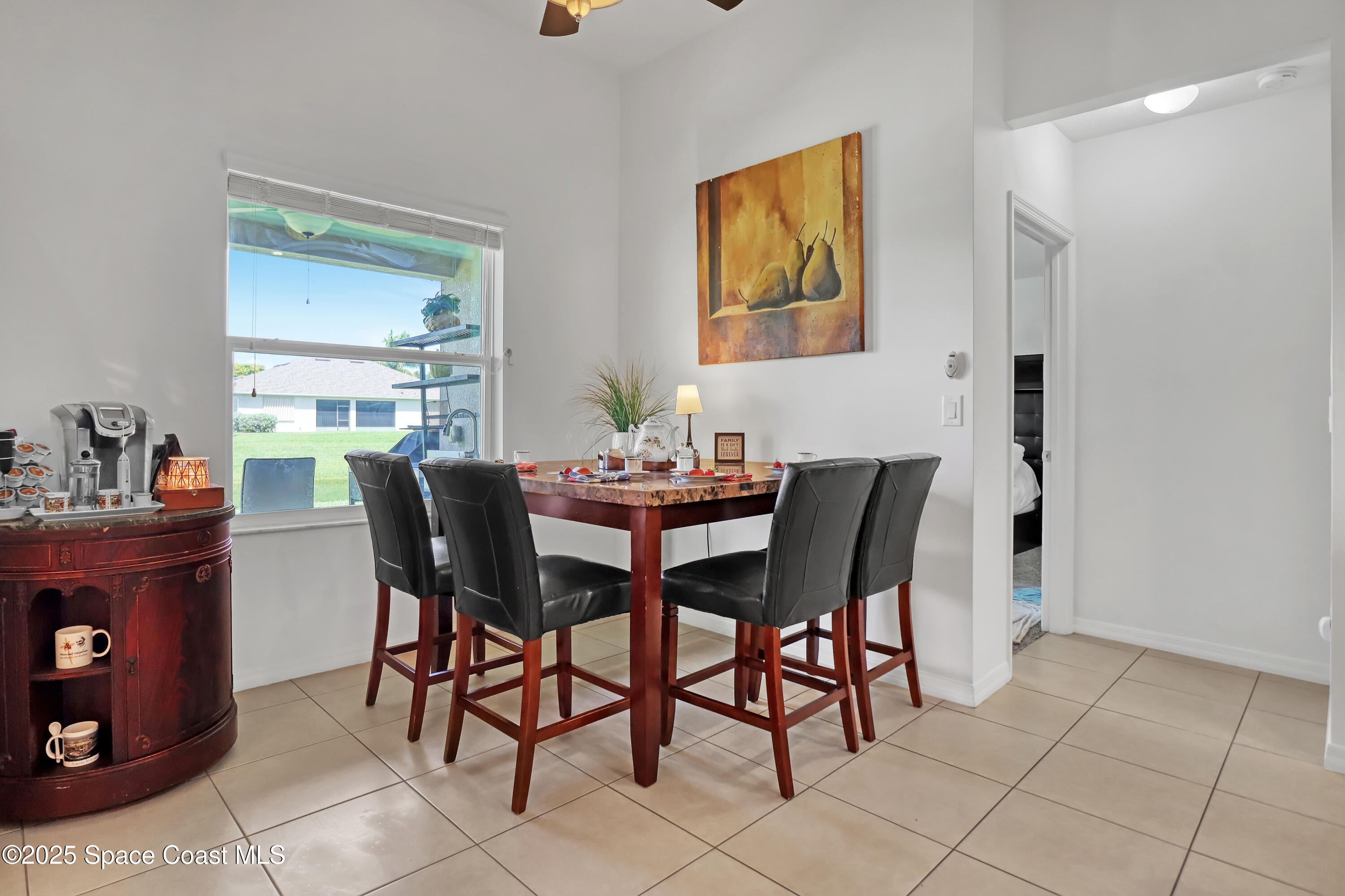 1121 Morgan Circle Northeast Palm Bay, FL 32905 - Photo 20 of 64 a view of a dining room with furniture