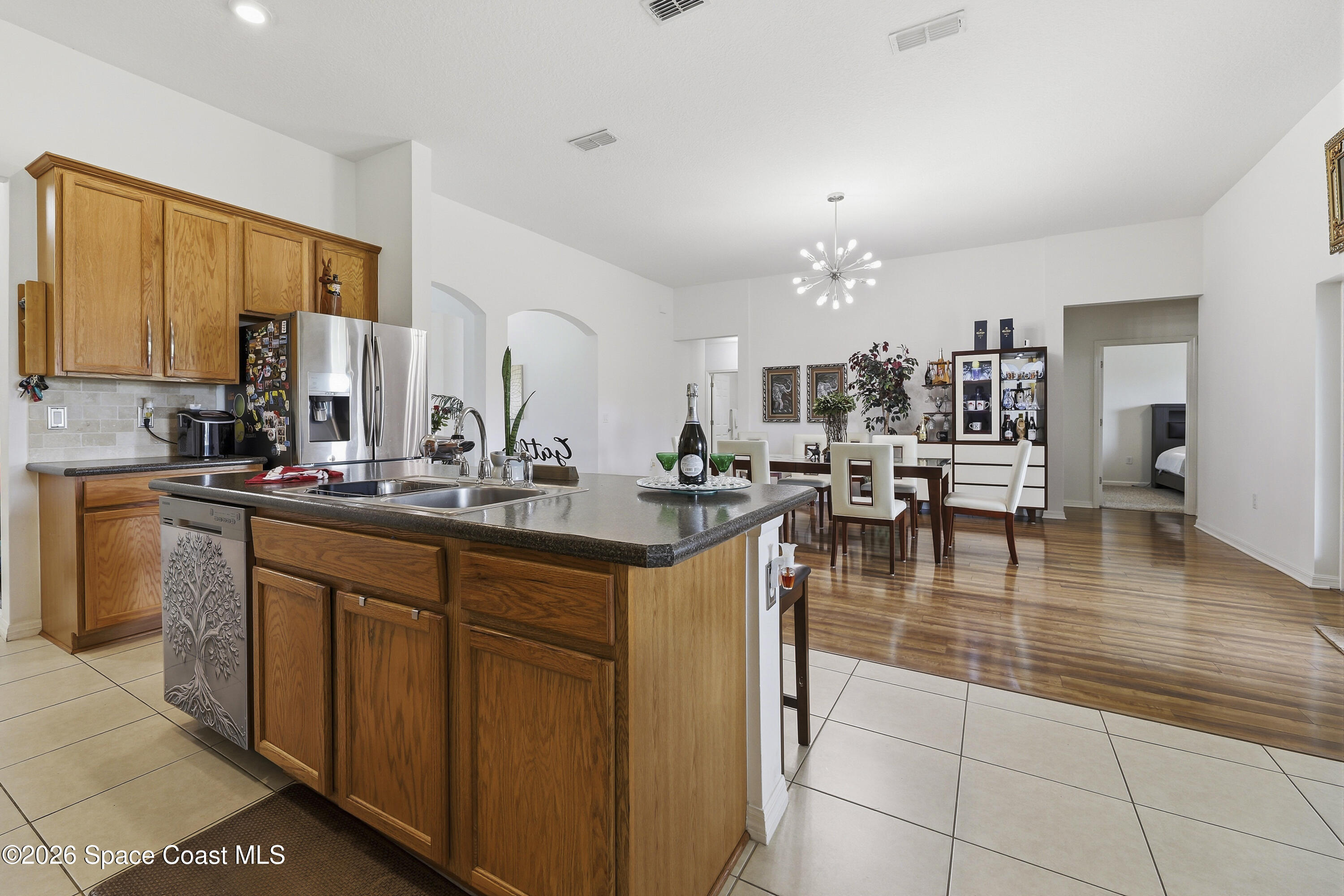 1121 Morgan Circle Northeast Palm Bay, FL 32905 - Photo 45 of 115 a kitchen with sink and cabinets