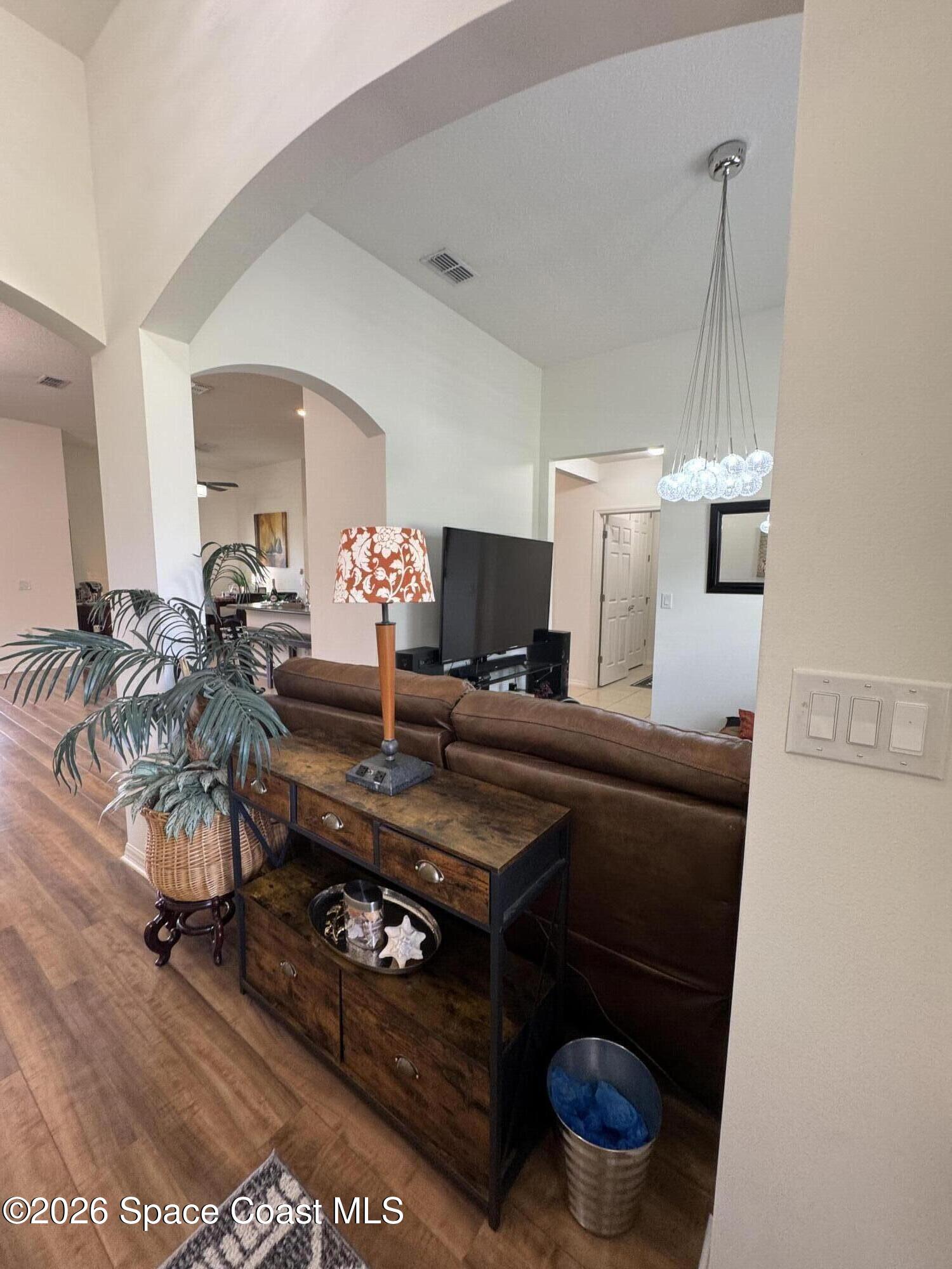 1121 Morgan Circle Northeast Palm Bay, FL 32905 - Photo 8 of 61 a room with furniture and a table