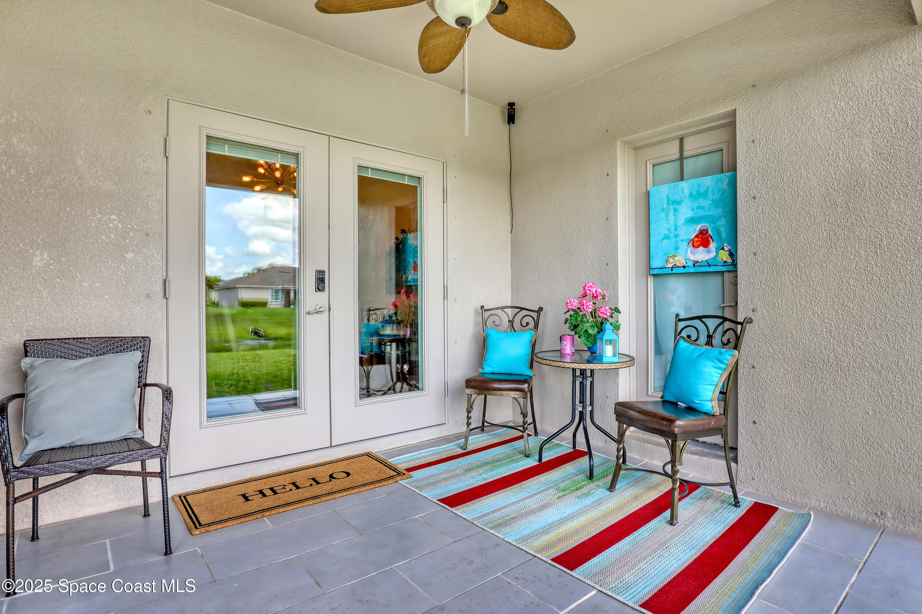 1121 Morgan Circle Northeast Palm Bay, FL 32905 - Photo 92 of 115 a living room with furniture and a potted plant