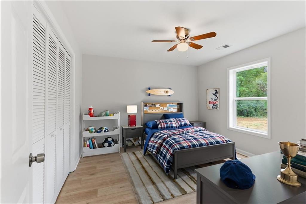 119 Jackson Street Cedartown, GA 30125 - Photo 27 of 58 a bedroom with a bed and a window