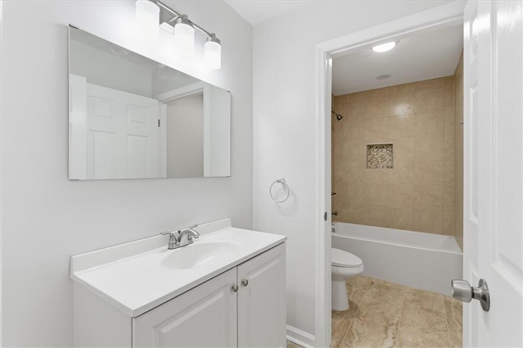 119 Jackson Street Cedartown, GA 30125 - Photo 34 of 58 a bathroom with a sink a toilet and shower