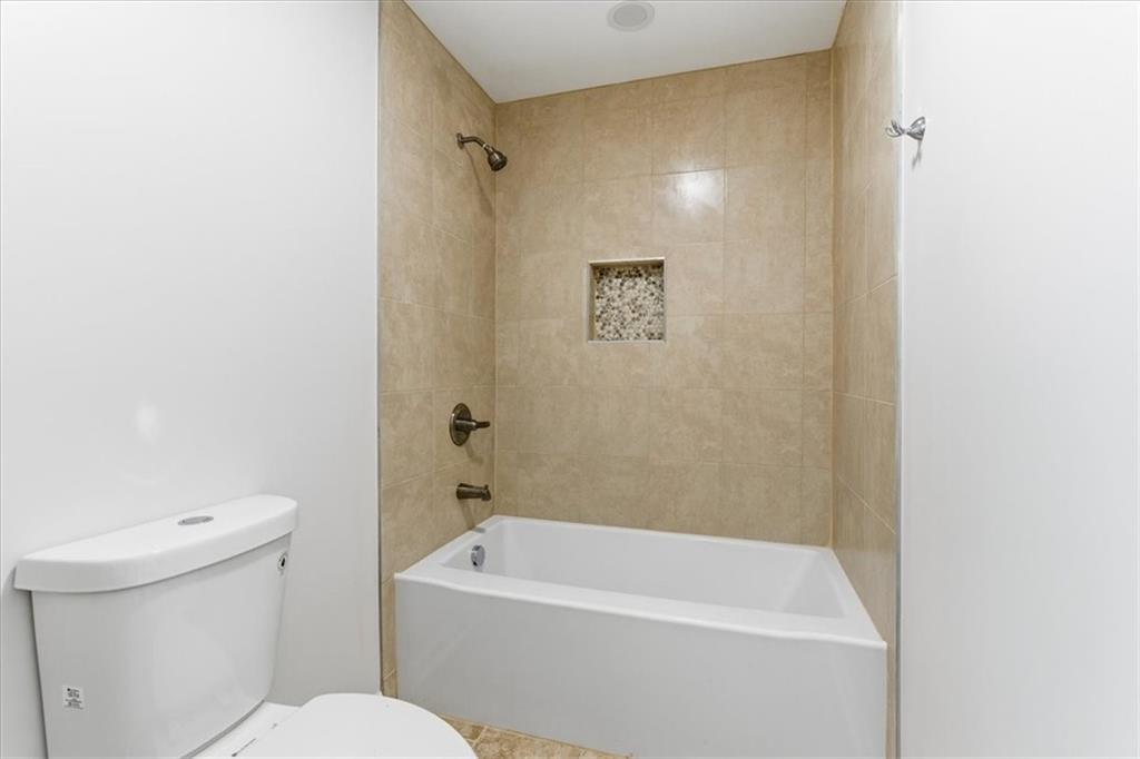 119 Jackson Street Cedartown, GA 30125 - Photo 35 of 58 a white toilet sitting next to a white bath tub
